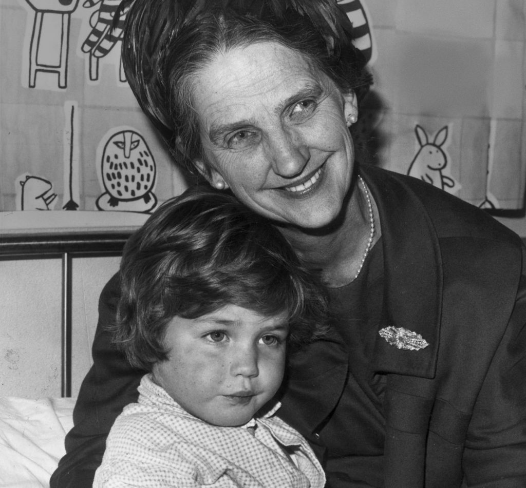 Dame Elisabeth Murdoch AC DBE with a child 